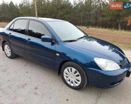 Синий Мицубиси Лансер, объемом двигателя 1.6 л и пробегом 222 тыс. км за 4599 $, фото 4 на Automoto.ua