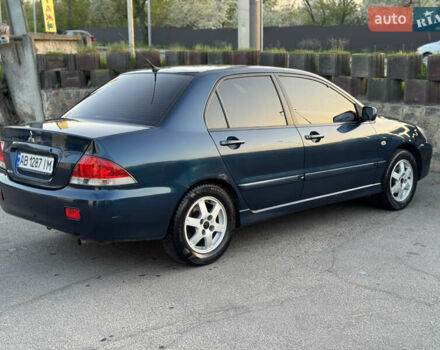 Синий Мицубиси Лансер, объемом двигателя 1.58 л и пробегом 300 тыс. км за 3650 $, фото 13 на Automoto.ua