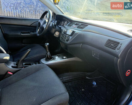 Синій Міцубісі Lancer, об'ємом двигуна 1.58 л та пробігом 269 тис. км за 3350 $, фото 22 на Automoto.ua