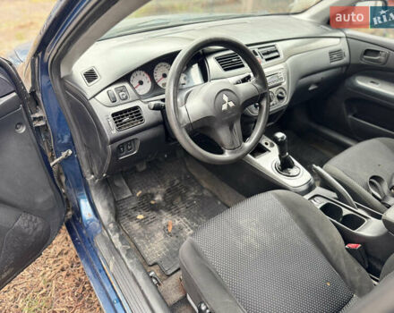 Синий Мицубиси Лансер, объемом двигателя 1.58 л и пробегом 243 тыс. км за 2900 $, фото 9 на Automoto.ua