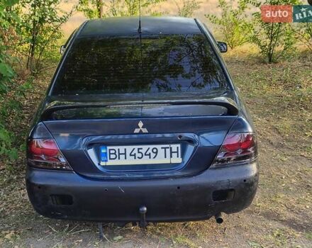 Синий Мицубиси Лансер, объемом двигателя 1.6 л и пробегом 360 тыс. км за 3000 $, фото 2 на Automoto.ua