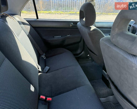 Синій Міцубісі Lancer, об'ємом двигуна 1.58 л та пробігом 269 тис. км за 3350 $, фото 20 на Automoto.ua