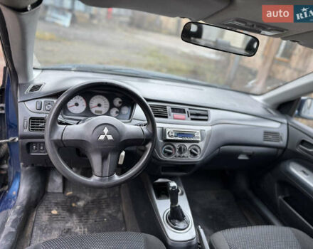 Синий Мицубиси Лансер, объемом двигателя 1.58 л и пробегом 243 тыс. км за 2900 $, фото 11 на Automoto.ua