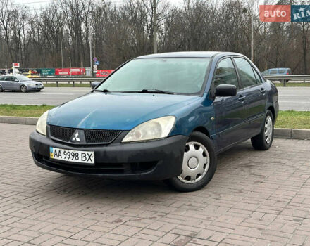 Синий Мицубиси Лансер, объемом двигателя 1.58 л и пробегом 260 тыс. км за 2300 $, фото 1 на Automoto.ua