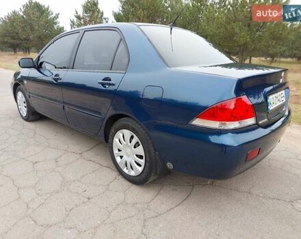 Синий Мицубиси Лансер, объемом двигателя 1.6 л и пробегом 222 тыс. км за 4599 $, фото 5 на Automoto.ua