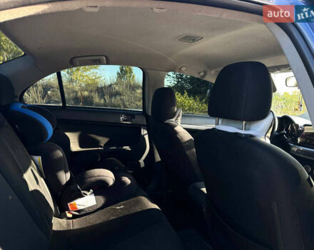 Синій Міцубісі Lancer, об'ємом двигуна 2 л та пробігом 240 тис. км за 6800 $, фото 10 на Automoto.ua