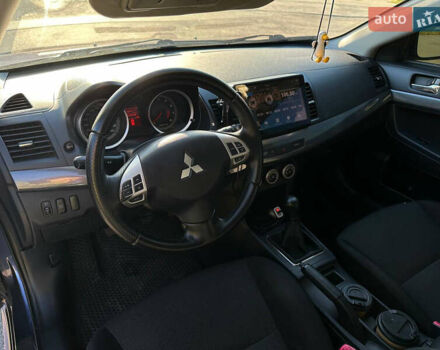 Синій Міцубісі Lancer, об'ємом двигуна 2 л та пробігом 240 тис. км за 6800 $, фото 6 на Automoto.ua
