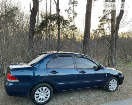 Синій Міцубісі Lancer, об'ємом двигуна 1.6 л та пробігом 176 тис. км за 6300 $, фото 1 на Automoto.ua