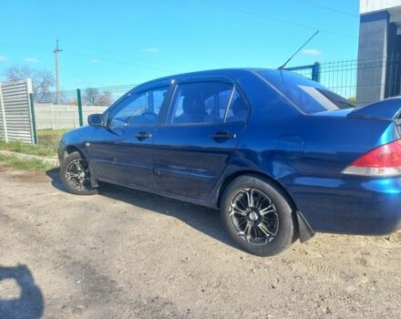 Синій Міцубісі Lancer, об'ємом двигуна 1 л та пробігом 111 тис. км за 3100 $, фото 1 на Automoto.ua