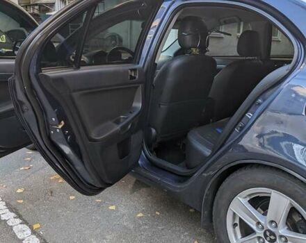 Синий Мицубиси Лансер, объемом двигателя 2 л и пробегом 300 тыс. км за 6250 $, фото 8 на Automoto.ua