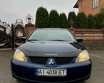 Синий Мицубиси Лансер, объемом двигателя 1.6 л и пробегом 185 тыс. км за 4950 $, фото 1 на Automoto.ua