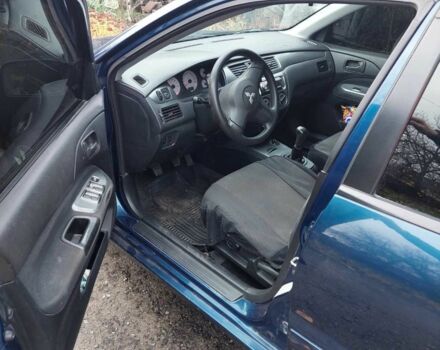 Синий Мицубиси Лансер, объемом двигателя 1.6 л и пробегом 87 тыс. км за 7000 $, фото 9 на Automoto.ua