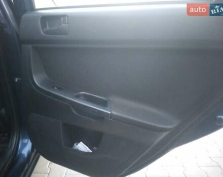 Синий Мицубиси Лансер, объемом двигателя 1.5 л и пробегом 260 тыс. км за 5000 $, фото 10 на Automoto.ua