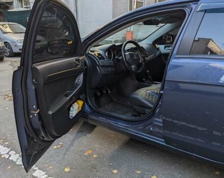 Синий Мицубиси Лансер, объемом двигателя 2 л и пробегом 300 тыс. км за 6250 $, фото 7 на Automoto.ua