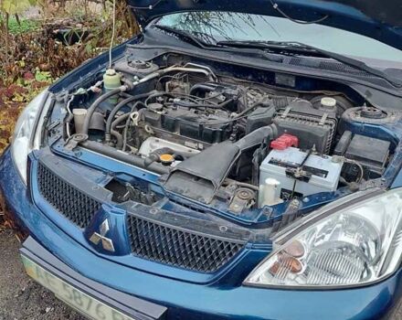 Синий Мицубиси Лансер, объемом двигателя 1.6 л и пробегом 87 тыс. км за 6800 $, фото 2 на Automoto.ua