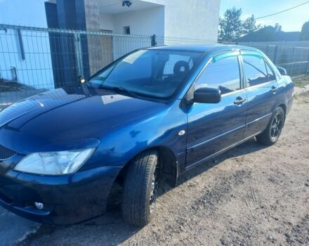 Синій Міцубісі Lancer, об'ємом двигуна 1 л та пробігом 111 тис. км за 3100 $, фото 4 на Automoto.ua