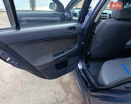 Синий Мицубиси Лансер, объемом двигателя 1.5 л и пробегом 211 тыс. км за 5222 $, фото 21 на Automoto.ua