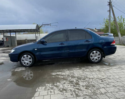 Синій Міцубісі Lancer, об'ємом двигуна 1.6 л та пробігом 245 тис. км за 3500 $, фото 2 на Automoto.ua