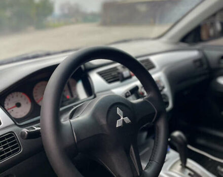 Синий Мицубиси Лансер, объемом двигателя 1.6 л и пробегом 185 тыс. км за 4950 $, фото 19 на Automoto.ua