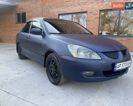 Синий Мицубиси Лансер, объемом двигателя 2 л и пробегом 100 тыс. км за 4999 $, фото 2 на Automoto.ua