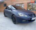 Синий Мицубиси Лансер, объемом двигателя 2 л и пробегом 100 тыс. км за 4999 $, фото 2 на Automoto.ua
