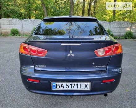 Синій Міцубісі Lancer, об'ємом двигуна 2 л та пробігом 155 тис. км за 7000 $, фото 11 на Automoto.ua