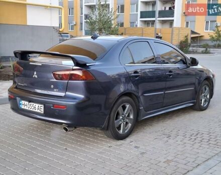 Синій Міцубісі Lancer, об'ємом двигуна 2 л та пробігом 234 тис. км за 6700 $, фото 5 на Automoto.ua