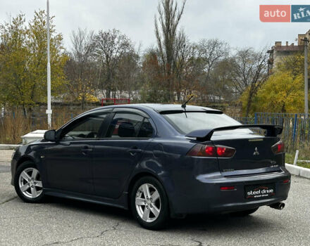 Синій Міцубісі Lancer, об'ємом двигуна 2 л та пробігом 222 тис. км за 5999 $, фото 4 на Automoto.ua
