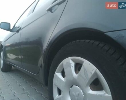 Синий Мицубиси Лансер, объемом двигателя 1.5 л и пробегом 260 тыс. км за 5000 $, фото 24 на Automoto.ua