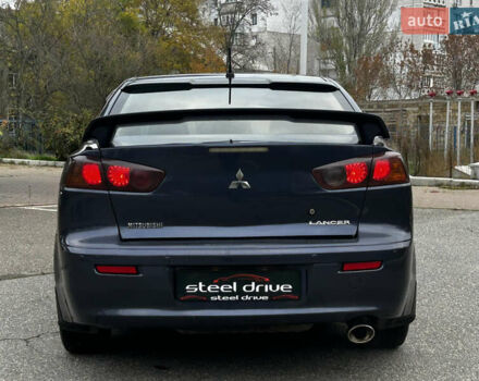 Синій Міцубісі Lancer, об'ємом двигуна 2 л та пробігом 222 тис. км за 5999 $, фото 3 на Automoto.ua