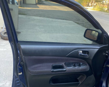 Синий Мицубиси Лансер, объемом двигателя 2 л и пробегом 100 тыс. км за 4999 $, фото 12 на Automoto.ua