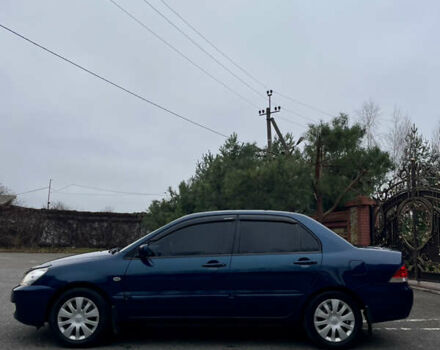 Синий Мицубиси Лансер, объемом двигателя 1.6 л и пробегом 185 тыс. км за 4950 $, фото 12 на Automoto.ua