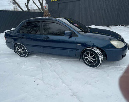 Синий Мицубиси Лансер, объемом двигателя 1.58 л и пробегом 319 тыс. км за 3700 $, фото 3 на Automoto.ua