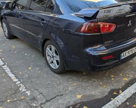 Синий Мицубиси Лансер, объемом двигателя 2 л и пробегом 300 тыс. км за 6250 $, фото 4 на Automoto.ua
