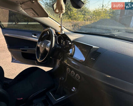 Синій Міцубісі Lancer, об'ємом двигуна 2 л та пробігом 240 тис. км за 6800 $, фото 9 на Automoto.ua