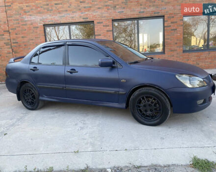 Синий Мицубиси Лансер, объемом двигателя 2 л и пробегом 100 тыс. км за 4999 $, фото 3 на Automoto.ua