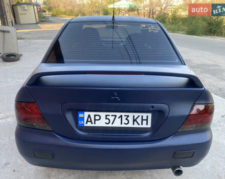 Синий Мицубиси Лансер, объемом двигателя 2 л и пробегом 100 тыс. км за 4999 $, фото 6 на Automoto.ua
