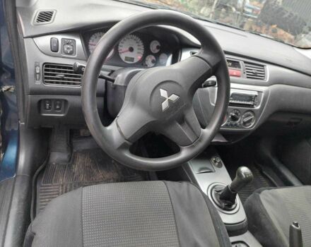 Синий Мицубиси Лансер, объемом двигателя 1.6 л и пробегом 87 тыс. км за 7000 $, фото 7 на Automoto.ua