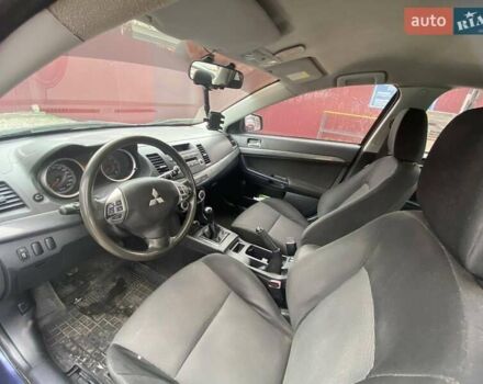Синій Міцубісі Lancer, об'ємом двигуна 2 л та пробігом 210 тис. км за 6800 $, фото 19 на Automoto.ua