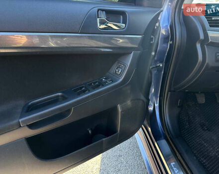 Синій Міцубісі Lancer, об'ємом двигуна 2 л та пробігом 240 тис. км за 6800 $, фото 7 на Automoto.ua