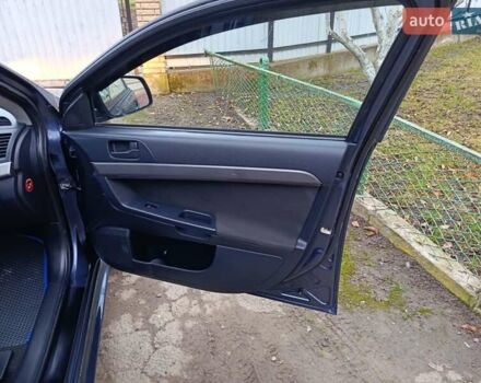 Синий Мицубиси Лансер, объемом двигателя 1.5 л и пробегом 211 тыс. км за 5222 $, фото 26 на Automoto.ua
