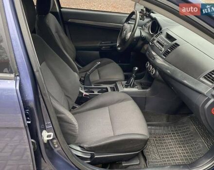 Синій Міцубісі Lancer, об'ємом двигуна 2 л та пробігом 210 тис. км за 6800 $, фото 22 на Automoto.ua