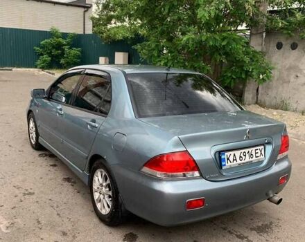 Синий Мицубиси Лансер, объемом двигателя 1.6 л и пробегом 270 тыс. км за 4600 $, фото 1 на Automoto.ua