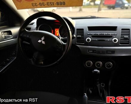 Синий Мицубиси Лансер, объемом двигателя 2 л и пробегом 189 тыс. км за 7350 $, фото 5 на Automoto.ua