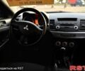 Синий Мицубиси Лансер, объемом двигателя 2 л и пробегом 189 тыс. км за 7350 $, фото 5 на Automoto.ua
