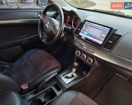 Синій Міцубісі Lancer, об'ємом двигуна 2 л та пробігом 234 тис. км за 6700 $, фото 19 на Automoto.ua