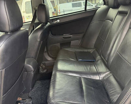 Синий Мицубиси Лансер, объемом двигателя 2 л и пробегом 326 тыс. км за 5650 $, фото 10 на Automoto.ua