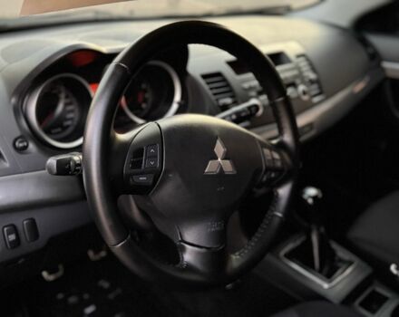 Синій Міцубісі Lancer, об'ємом двигуна 2 л та пробігом 189 тис. км за 7350 $, фото 11 на Automoto.ua