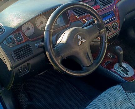 Синій Міцубісі Lancer, об'ємом двигуна 1.6 л та пробігом 285 тис. км за 3700 $, фото 12 на Automoto.ua