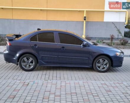 Синій Міцубісі Lancer, об'ємом двигуна 2 л та пробігом 234 тис. км за 6700 $, фото 7 на Automoto.ua